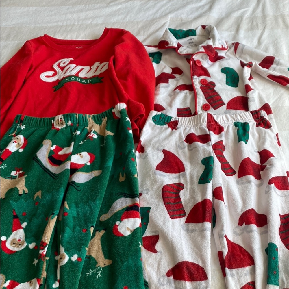 2 sets kids Christmas pajamas. A little worn but documented in pictures.